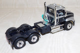 #60-1954 Black & Silver Mack Pinnacle Day Cab & 53' Wilson Roadbrute Flatbed Trailer with Shrink Wrapped Paper Tubes on Pallets Load