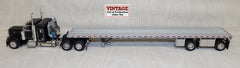 #30468 1/64 Black Peterbilt 379 with 36" Sleeper and Wilson Roadbrute Spread-Axle Flatbed Trailer