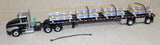 #60-1954 Black & Silver Mack Pinnacle Day Cab & 53' Wilson Roadbrute Flatbed Trailer with Shrink Wrapped Paper Tubes on Pallets Load