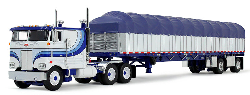 #60-2057 1/64 White & Blue Peterbilt Model 352 COE 110" Sleeper & 53' Wilson Roadbrute Flatbed Spread-Axle Trailer with Covered Wagon