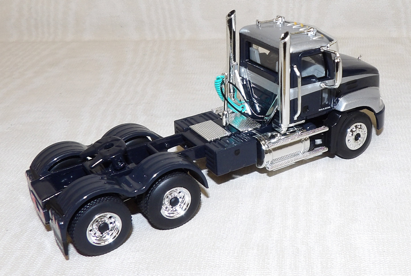 Silver Mack #619541 1/64 Black & Silver Mack Pinnacle Day Cab - No Box | Action Toys