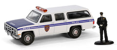 #97160-D 1/64 NYPD Transit 1985 GMC Suburban 2500 with Police Officer