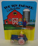 #4574 Toy Farmer Zeke on Tractor